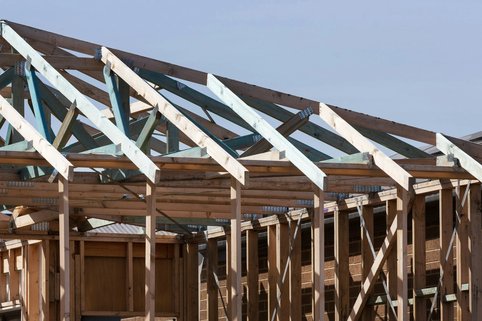Roof trusses going up on a new home in Polk County