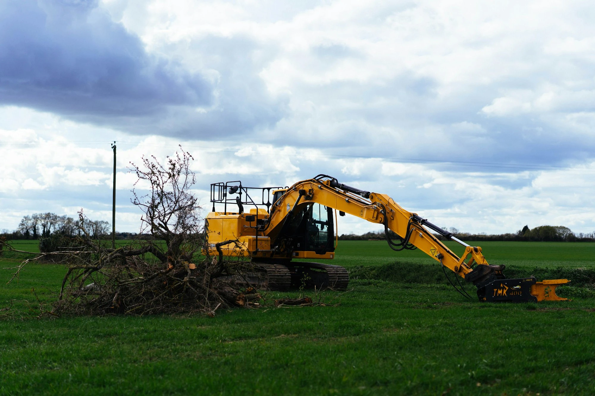 Excavator clearing a lot for a new home in Auburndale