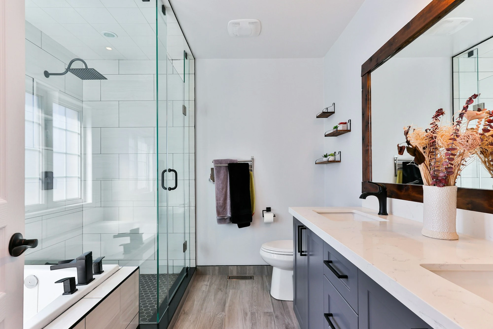 Remodeled bathroom with a walk-in shower and new vanity