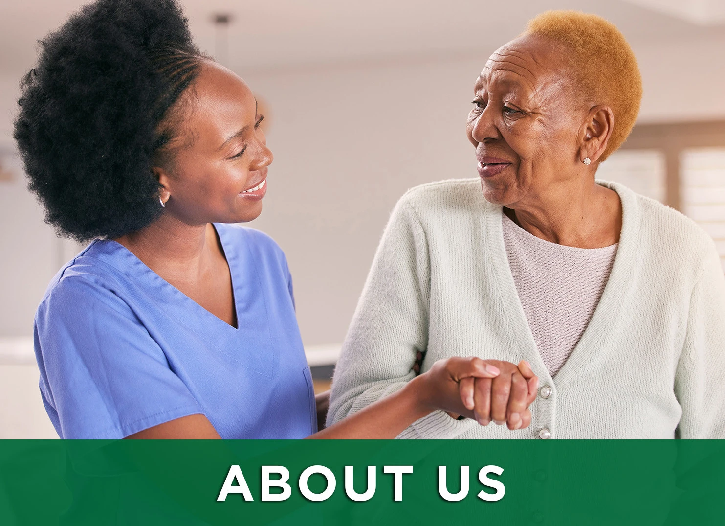 Image: senior woman and caretaker smiling at one another with a link to the about us page