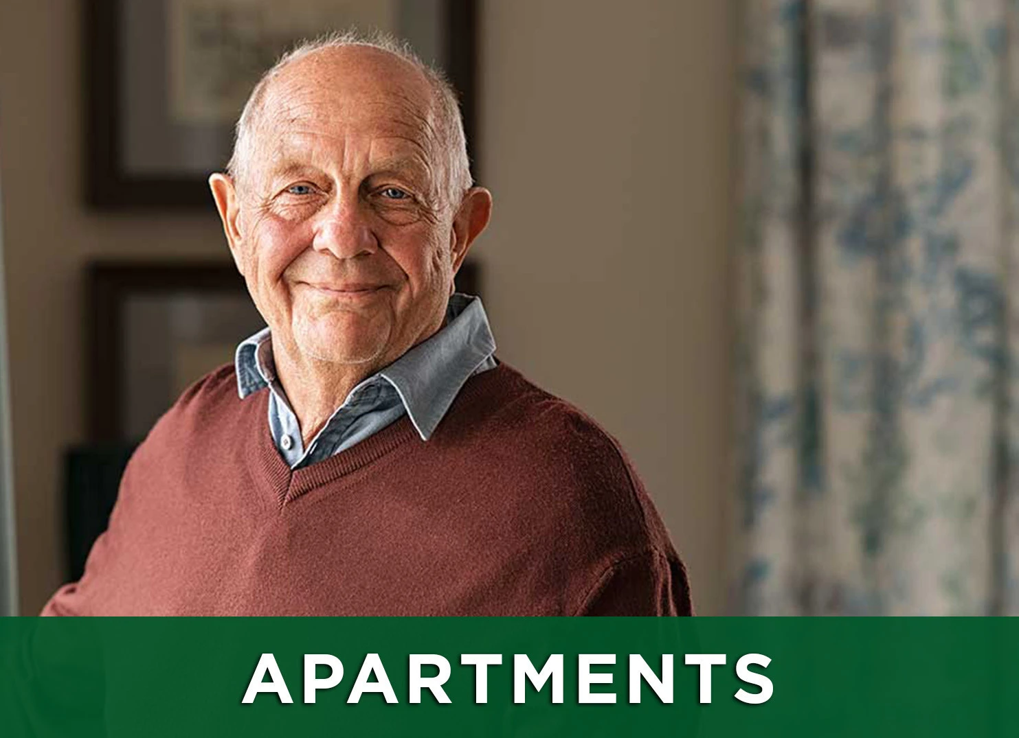 Image of senior man standing in apartment with a link to the page to view floor plans