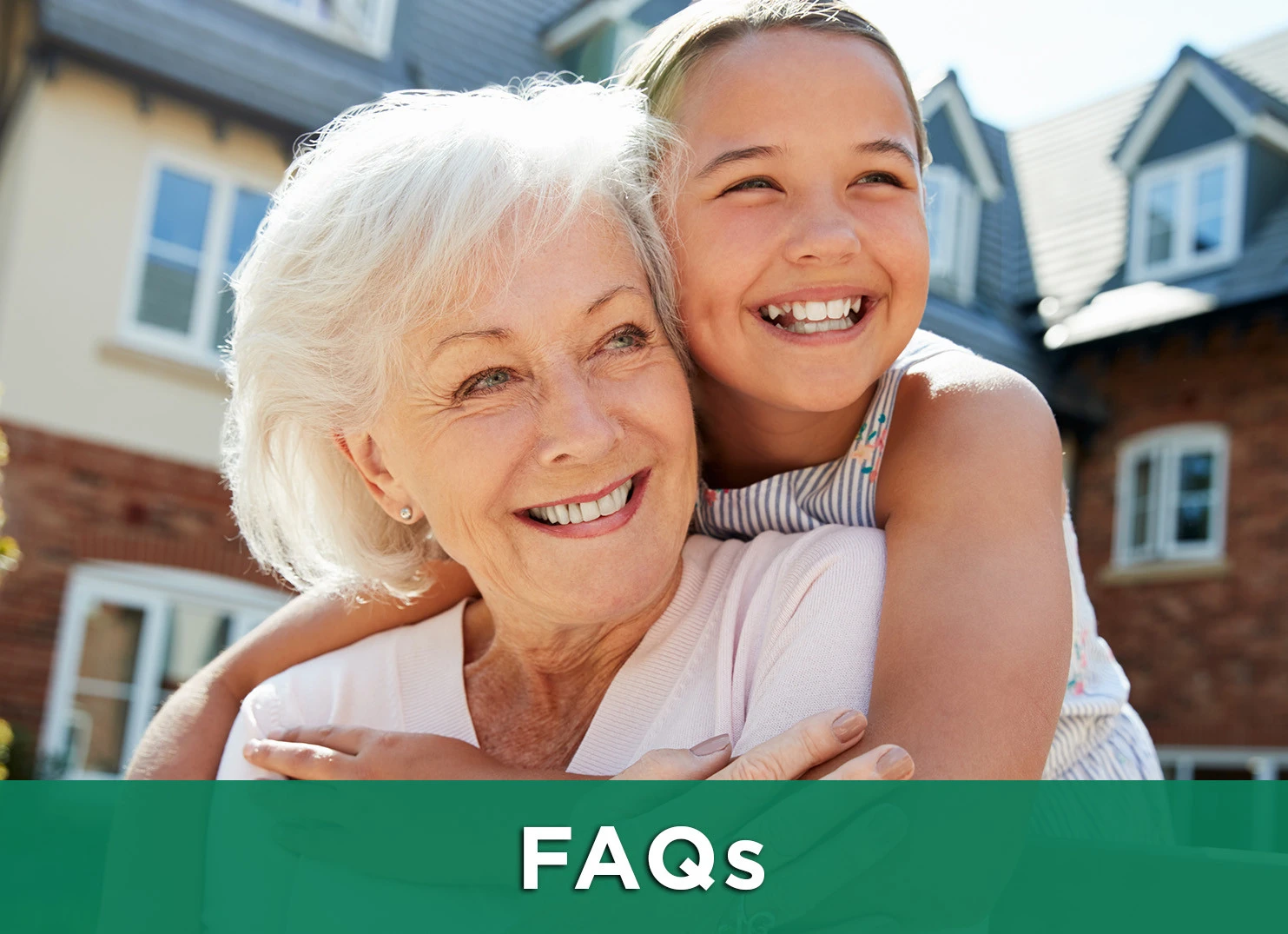 Image: Grandmother and granddaughter hugging outdoors with a link to the FAQ page.