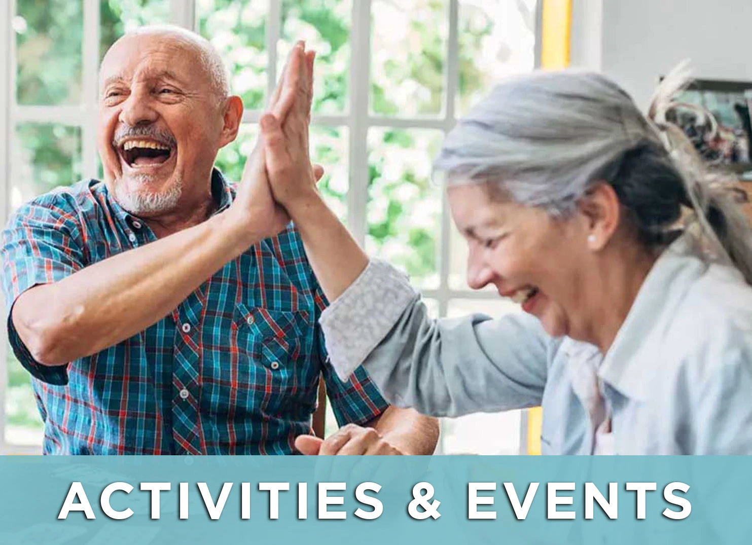 Image of senior man and woman high five during a game with a link to the Activities and Events page for more information