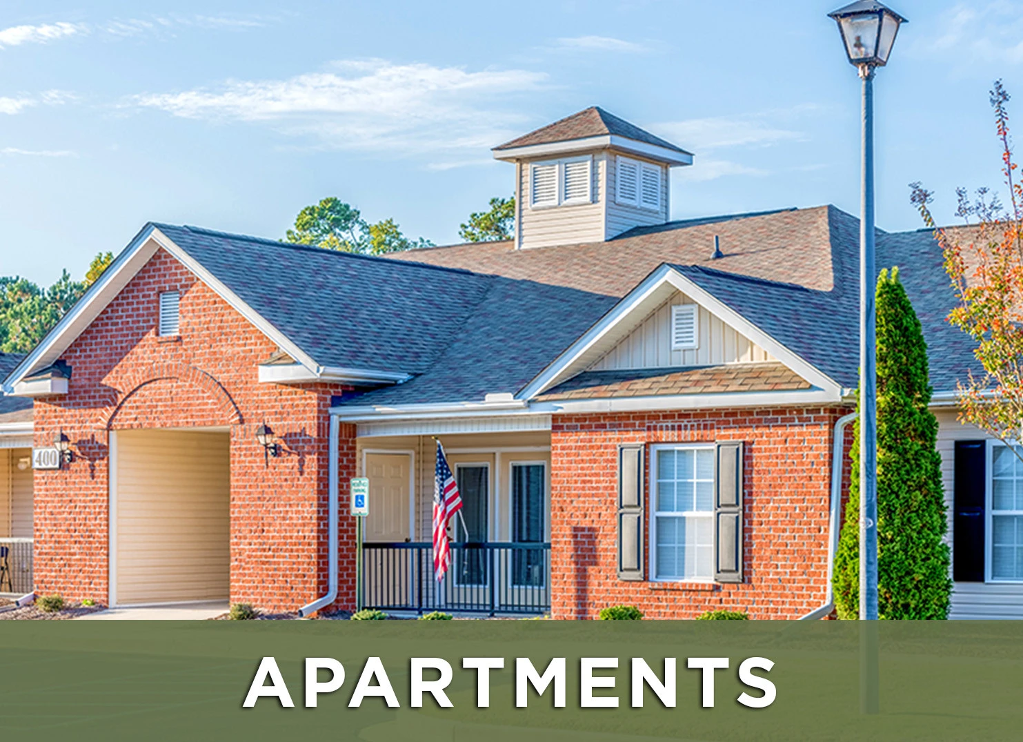 Image of exterior of Mill Creek Manor with a link to the Apartment page for more information