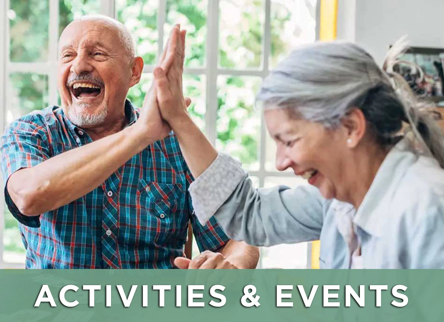 Image of two friends playing a game and sharing a high five with a like to the Activities and Events page for more information