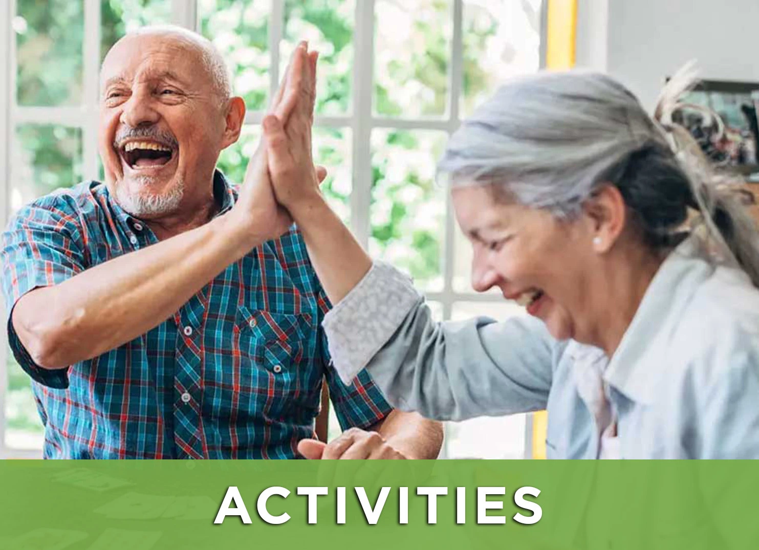 Image of two senior friends enjoying a card game with a link to the activities page for more information