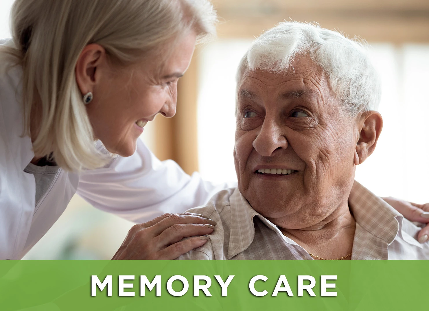 Image: Senior man smiling at caregiver; Link to Memory Care web page