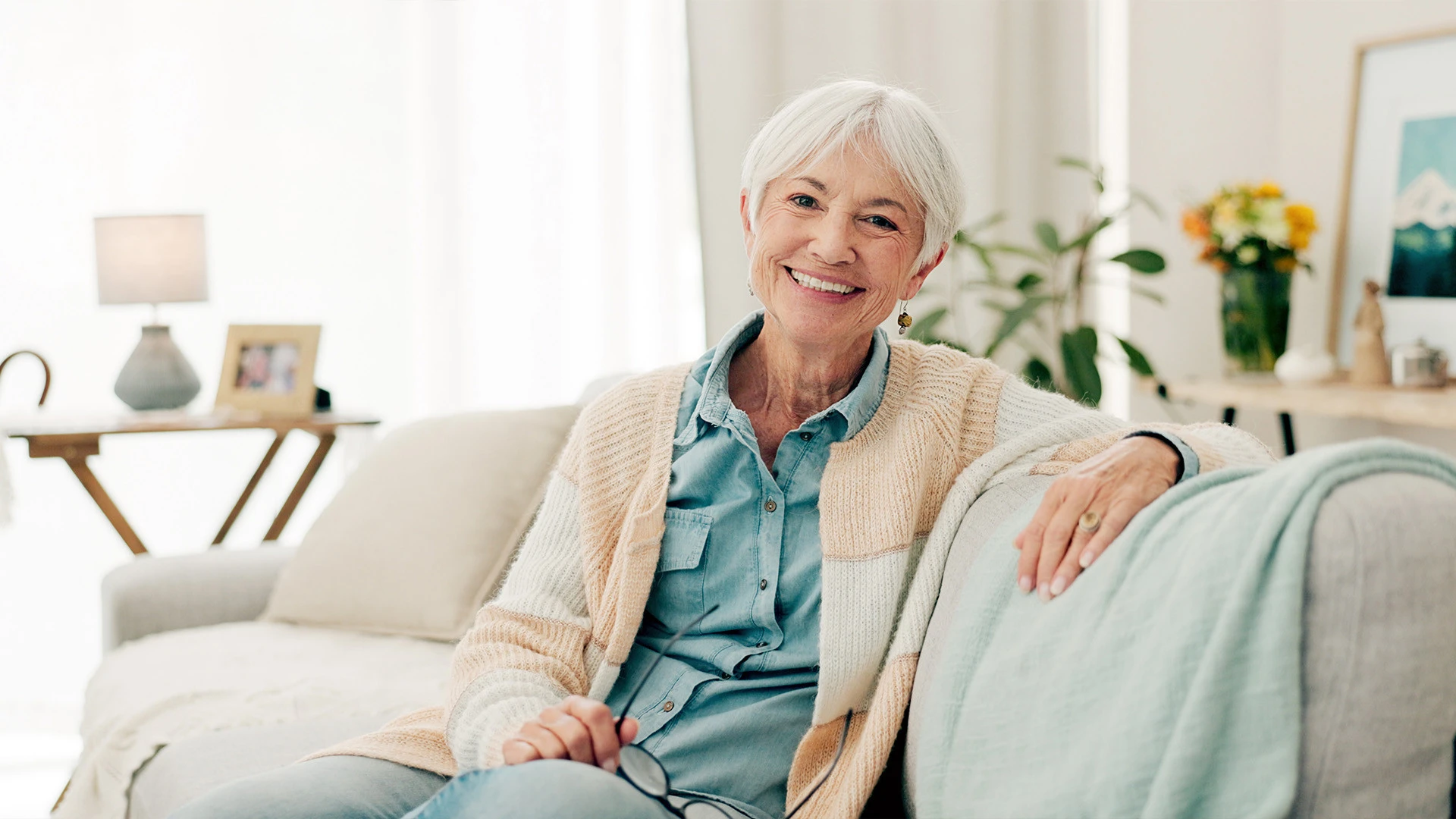 Elderly man proudly standing in his assisted living apartment