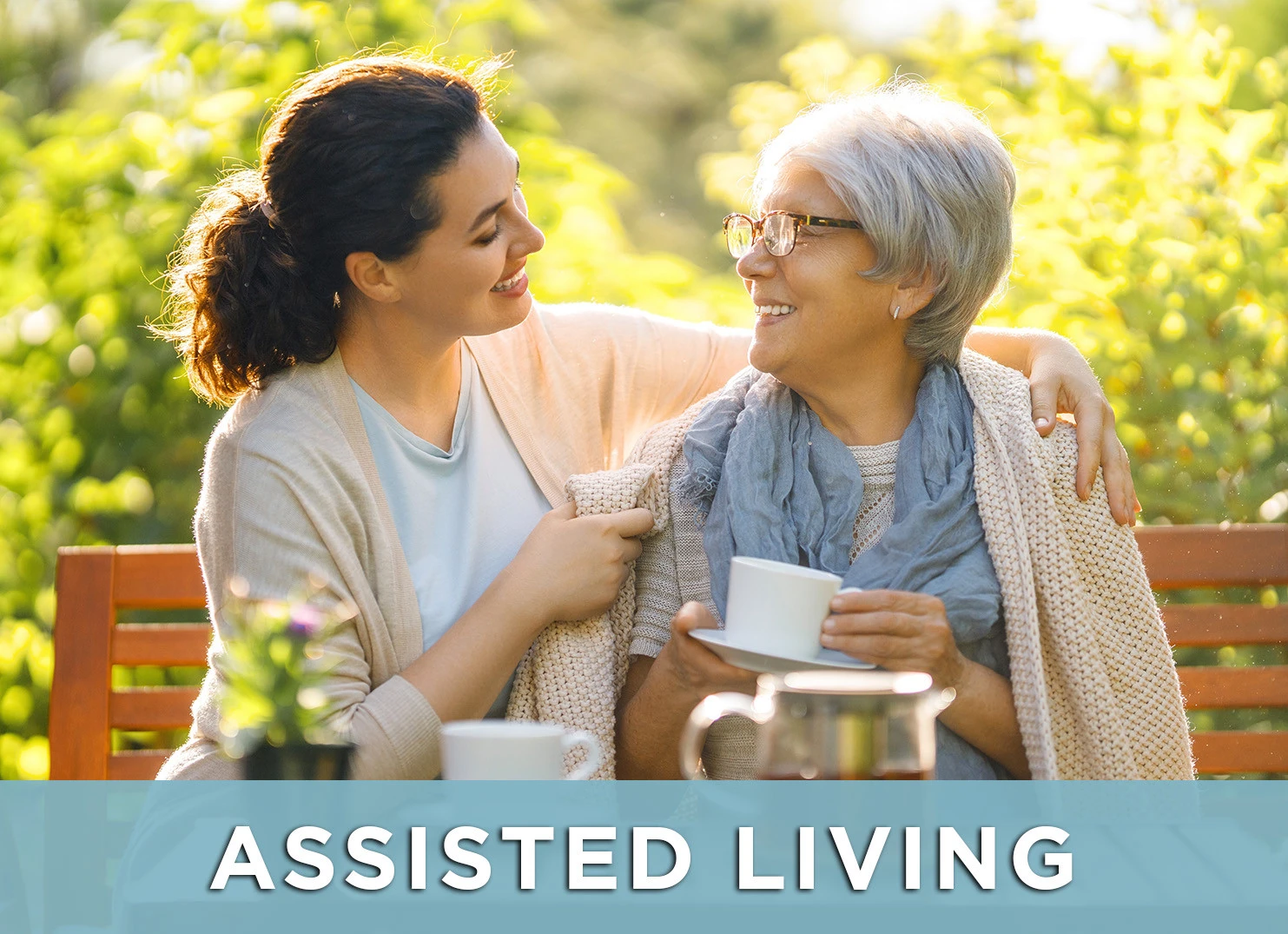 Image of senior woman and adult daughter smiling with a link to the Assisted Living page for more information