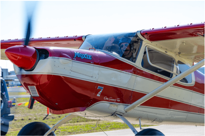 Photo Credit: Kelly Qualls. Joel Dopson celebrates his performance in “Moxie” the  #7 1956 Cessna 172 Taildragger.