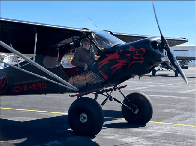 Photo credit: Kelly Qualls. Keith Lange in “Pepper” his #50 1956 Piper Super Cub, one of many airplanes in Lange’s Lone Wolf STOL fleet 